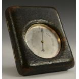 An early 20th century silvered travelling pocket aneroid barometer, 6cm dial inscribed E.B.