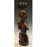 Tribal Art - a Yoruba Obeji figure, kneeling, traces of blue pigment, 22cm high,