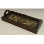 A 19th century Chinese hardwood rectangular tray, carved throughout with leafy bamboo,