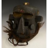 Tribal Art - a Kuba/Kete helmet mask, highly stylised geometric features,