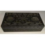 A Colonial ebony box and cover, carved in relief with stylised birds,