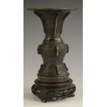 A 19th century Chinese bronze gu beaker vase, cast in the Archaic manner, 14cm high,