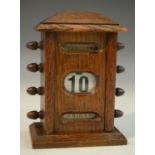 An early 20th century oak perpetual desk calendar,