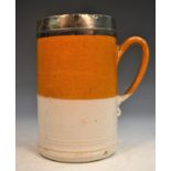 An early 18th century silver-mounted London stoneware quart mug, quite plain,