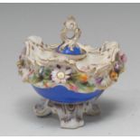 A Coalbrookdale inkwell, of rococo form, encrusted with flowers and foliage, blue base and cover,