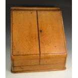 A late Victorian oak slope front desk top writing cabinet,