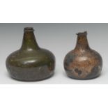 An 18th century onion bottle, kick-up base, 16cm high; another,