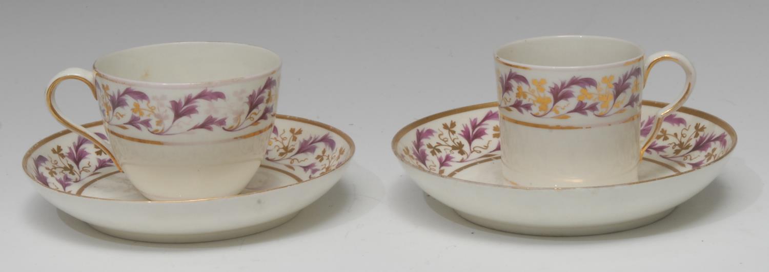 A Pinxton coffee can, Bute shape tea cup and two saucers, pattern No.