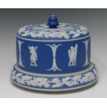 A Wedgwood type blue jasper stilton dome, typically sprigged in white with classical figures,