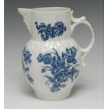 A Caughley cabbage leaf moulded mask jug, printed in underglaze blue with flower sprays,