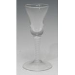 A George III opaque twist wine glass, trumpet-shaped bowl, double-helix stem, domed circular foot,