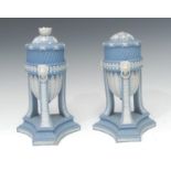 A pair of Wedgwood blue jasper cassolettes, the ovoid bowls applied white relief with stiff leaves,