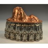 A 19th century copper and tin novelty jelly mould, as a recumbent lion,