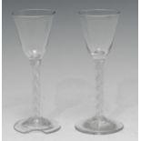 A pair of 18th century cordial glasses, air twist stems, spreading base, 15.5cm high, c.