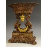 A 19th century bronze centrepiece , the flared oval bowl in relief with anthemions and flowerheads,