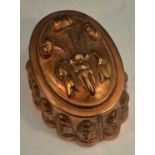 A 19th century copper novelty jelly mould, embossed with Prince of Wales feathers,