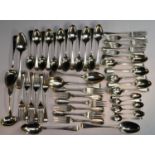 A set of six silver Hanoverian pattern dessert forks; a set of six similar table forks;