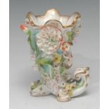 A Colaport/Minton cornucopia vase, encrusted overall with flowers and foliage, picked out in gilt,