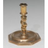 A Continental brass squat candlestick, spirally twisted pillar, dished octagonal base,