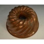 A large 19th century copper jelly mould, domed and spirally fluted, 31.
