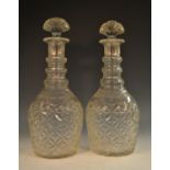A goliath pair of post-Regency glass Prussian-shaped decanters and stoppers, hobnail cut,