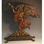 A 19th century cast iron door stop, Britannia, blowing her trumpet, standing on a cloud,