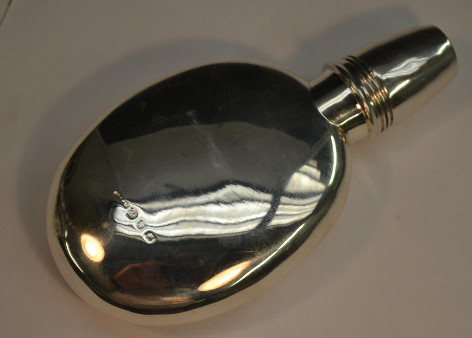 A Victorian silver huntsman's pocket flask, screw-fitting cover with stirrup-cup, 15cm long,