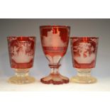 A pair of 19th century Bohemian ruby glass goblets,