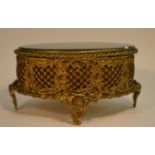 A 19th century gilt metal and spinach jade oval casket, hinged cover,