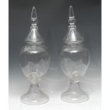 A pair of 19th century clear glass Chemist/apothecary jars, lofty cover, fluted bases, c.