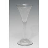 A George III wine glass, quite plain, trumpet-shaped bowl, clear stem, domed foot, slight pontil,