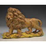 A 19th century cast iron novelty door stop, as a lion, painted in polychrome, 22.5cm wide, c.