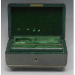 An early 20th century green tooled leather musical jewellery box, embossed hinged cover,