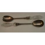 A pair of Edwardian silver salad servers, hobnail-cut clear glass hafts,