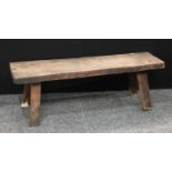 A 19th century elm pig bench