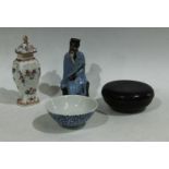 A Chinese blue and white bowl; an Armorial vase and cover; a figure,