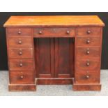 A Victorian mahogany kneehole desk, oversailing rectangular top above three frieze drawers,