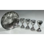 A large bowl and four goblets by Stephen Daley made from Aluminium