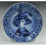 A Delft circular charger, painted in underglaze blue, after Rembrant van Rijn, self portrait, 42.