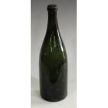 A 19th century green wine bottle, kick-up base,