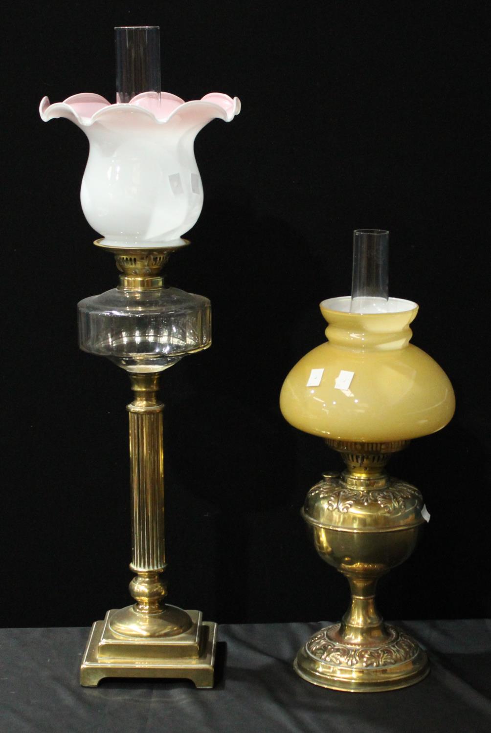 A Victorian brass and clear glass Corinthian column oil lamp,