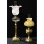 A Victorian brass and clear glass Corinthian column oil lamp,