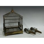 A brass birdcage by Genycage;