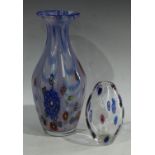 A Murano slender baluster vase, with latticino strands and millefiori canes, in shades of blue,