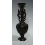 A Chinese bronze slender ovoid vase, the tall flared neck applied with a pair of dragons,