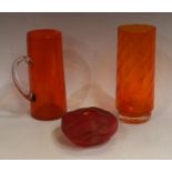 A studio glass compressed ovoid pebble vase, by Roger Tye, in flame shades of red and orange,