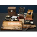A micrometer, boxed; a students microscope,