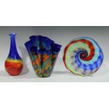 A large art glass handkerchief vase, in vivid shades of blue, orange and green,