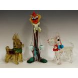 A Murano glass novelty model of a terrier, in clear glass with red and blue collar with bow,