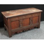 An early 18th century oak blanket chest, hinged top enclosing a till,